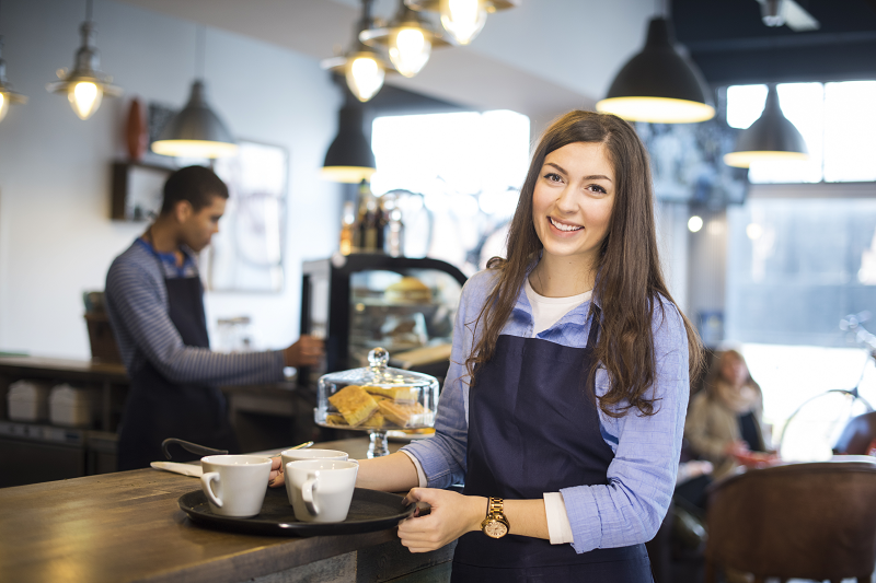 waitress wearing a neck strap apron