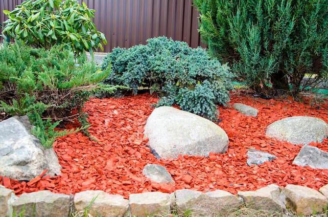 wood chips in garden with stones