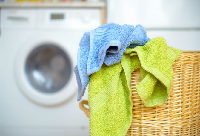 bamboo towels in the bathroom in front of the wash machine