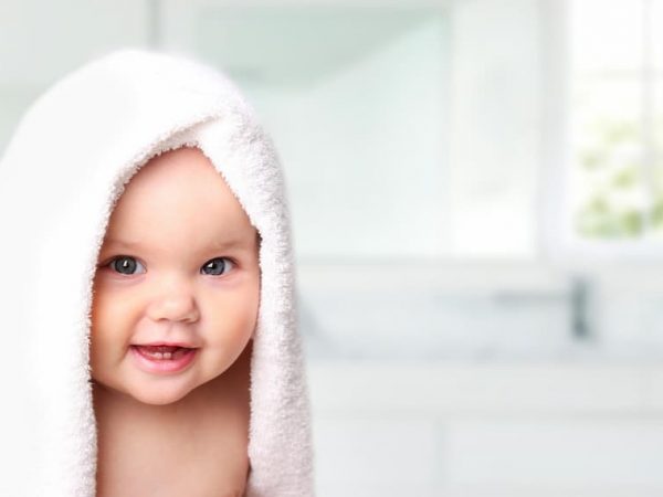baby with towel on his head