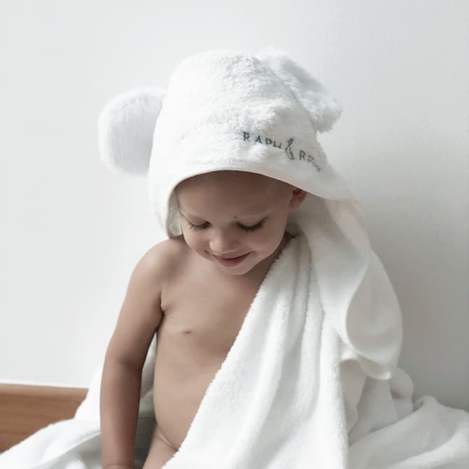 baby with white bamboo baby towel