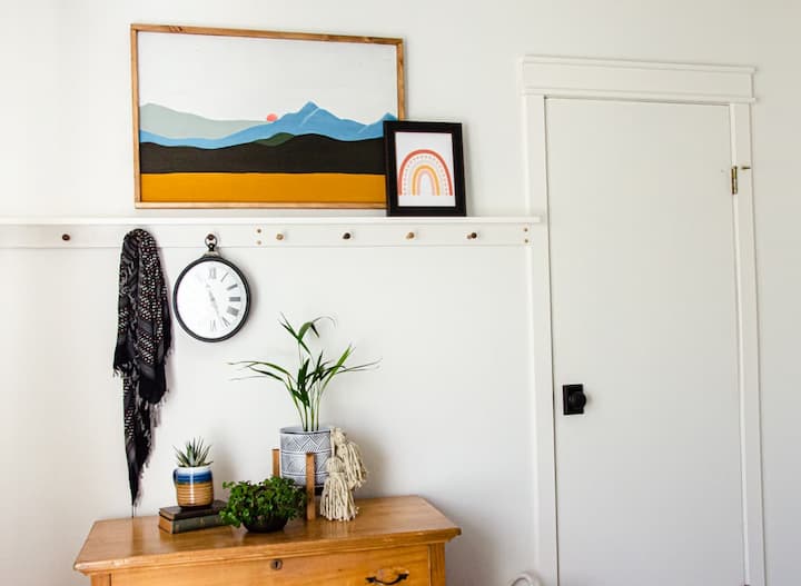 boho style accessories and white door with black door knob