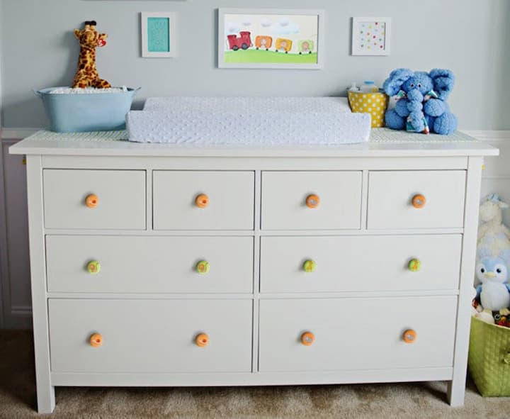kids room with decorative knobs on their wardrobe