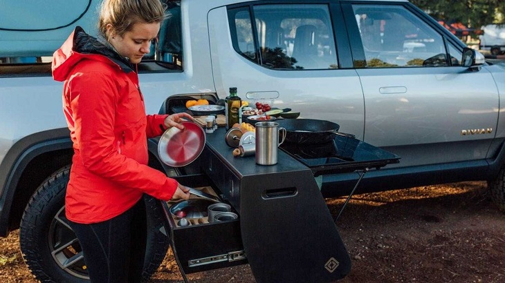 girl preparing camp kitchen