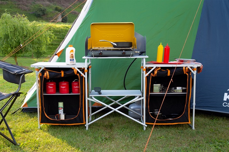 camping cupboards with tent in background