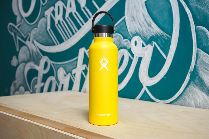 yellow hydro flask water bottle on wooden table 