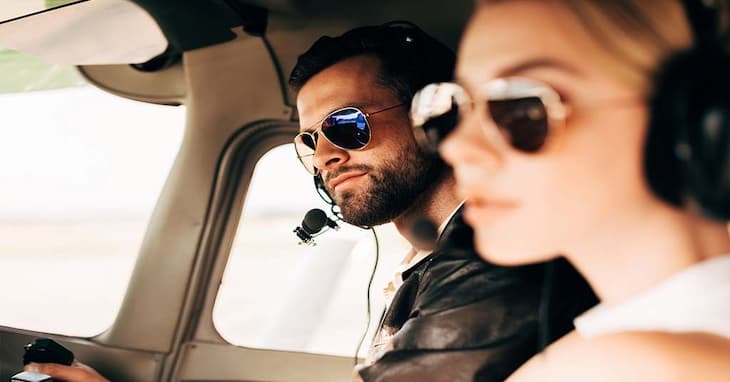 Man and woman wearing Non-Polarized pilot sunglasses in helicopter