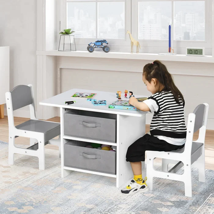 Gril is sitting at Storage table in kids room 
