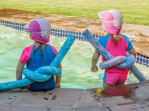 Two kids in the swimming pool