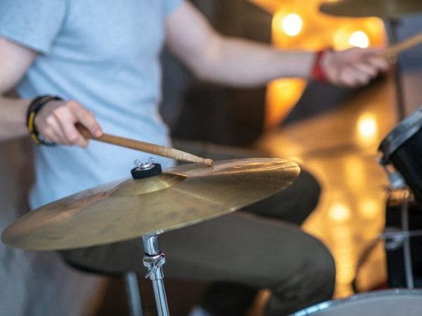 man playing his drum set