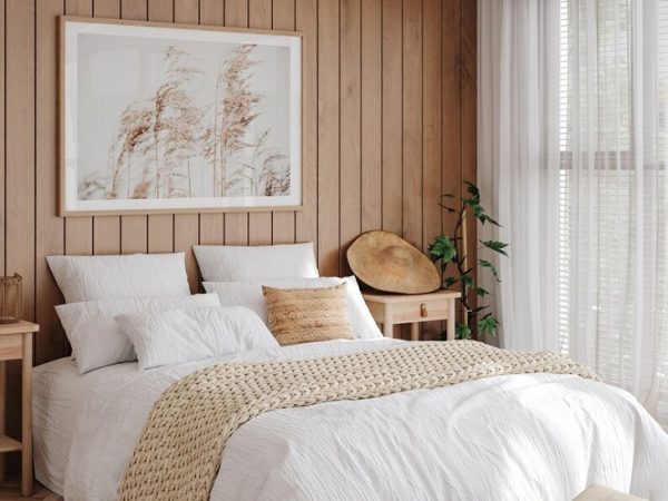 A bedroom with with an photo above the bed