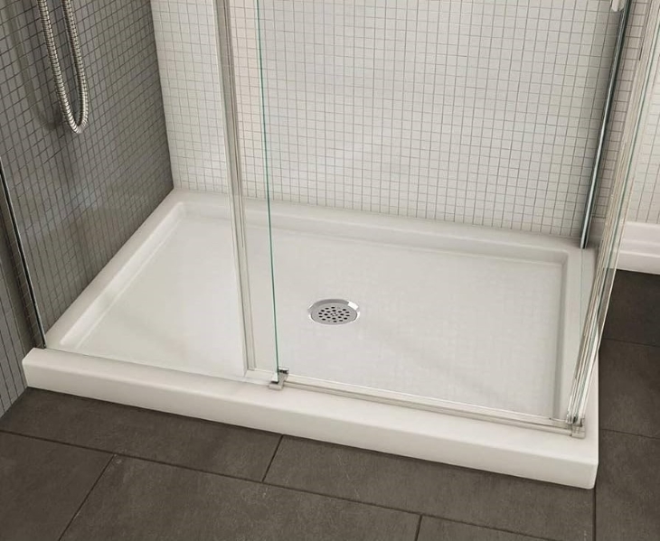white and brown tiles with white shower base