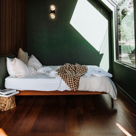 bedroom bed in front of a big window