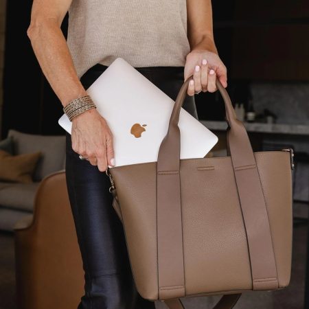 woman holding laptop bag