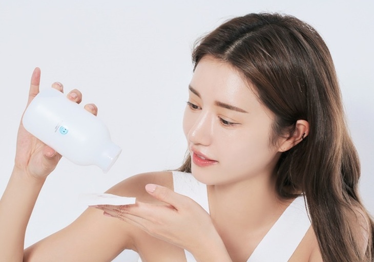 woman applying quality Korean face toner